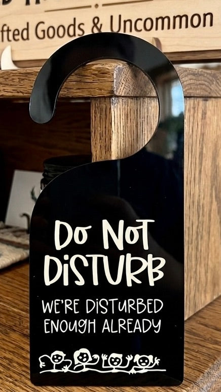 "Do Not Disturb — We're Disturbed Enough Already" Door Hanger
